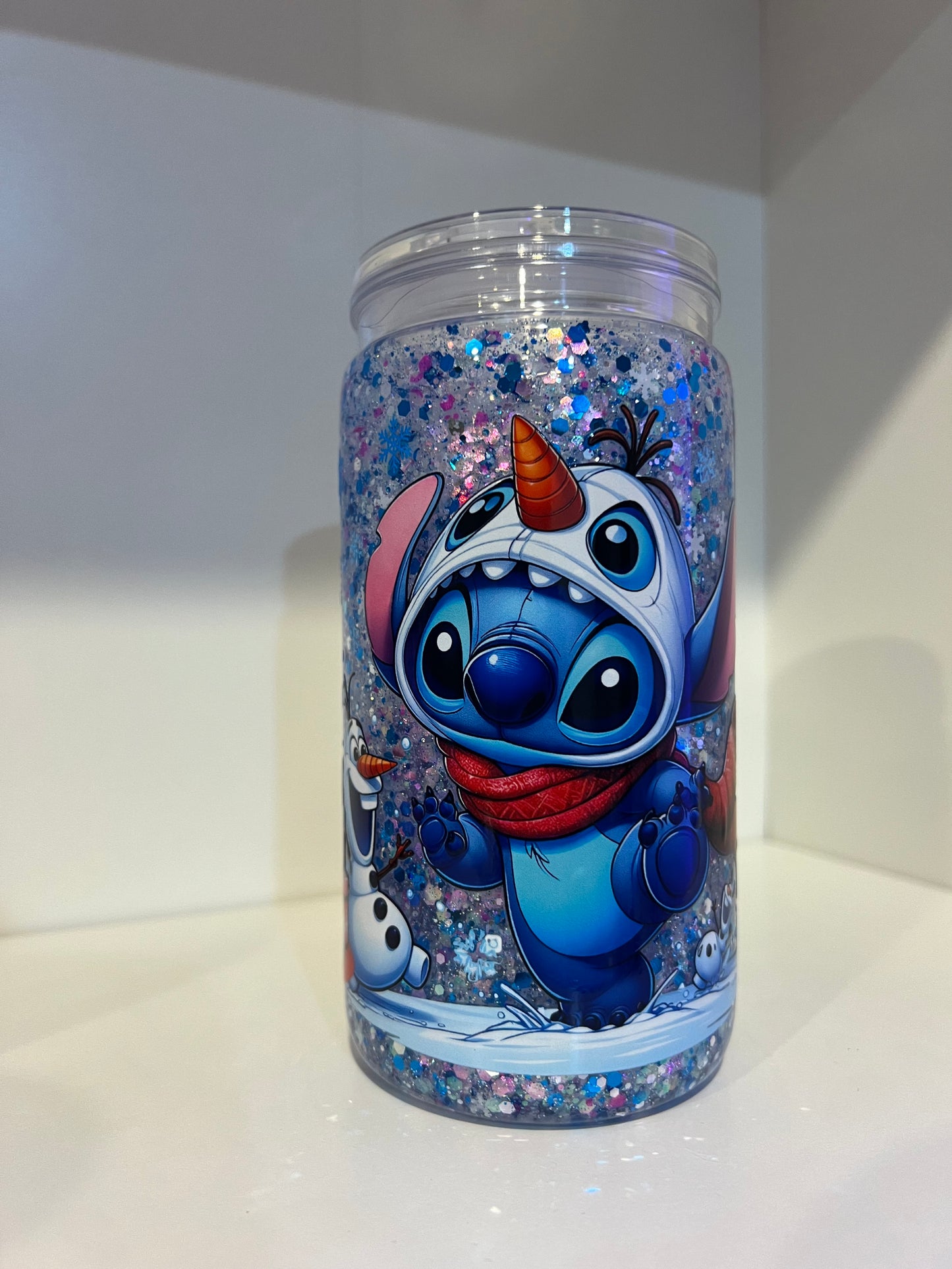 Blue guy and snowman Christmas Snow Globe Tumbler β 16oz Glitter Edition